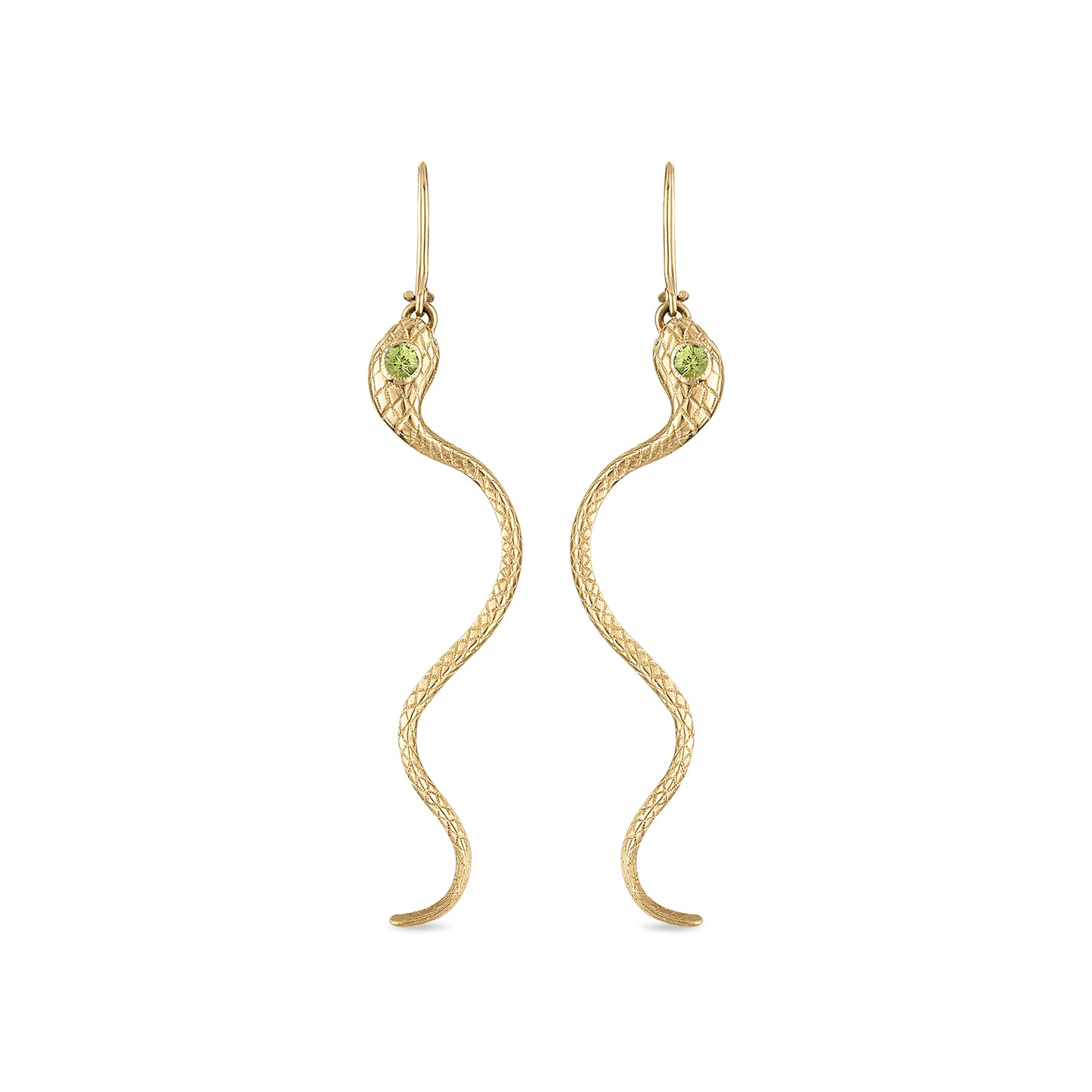 A pair of 14k gold snake earrings with engraved scales, milgrain bezel set yellow green sapphire head stones and diamond eye stones. The closed shepherd hook earrings each have a snake suspended by a ring in its mouth and long tail curving down.