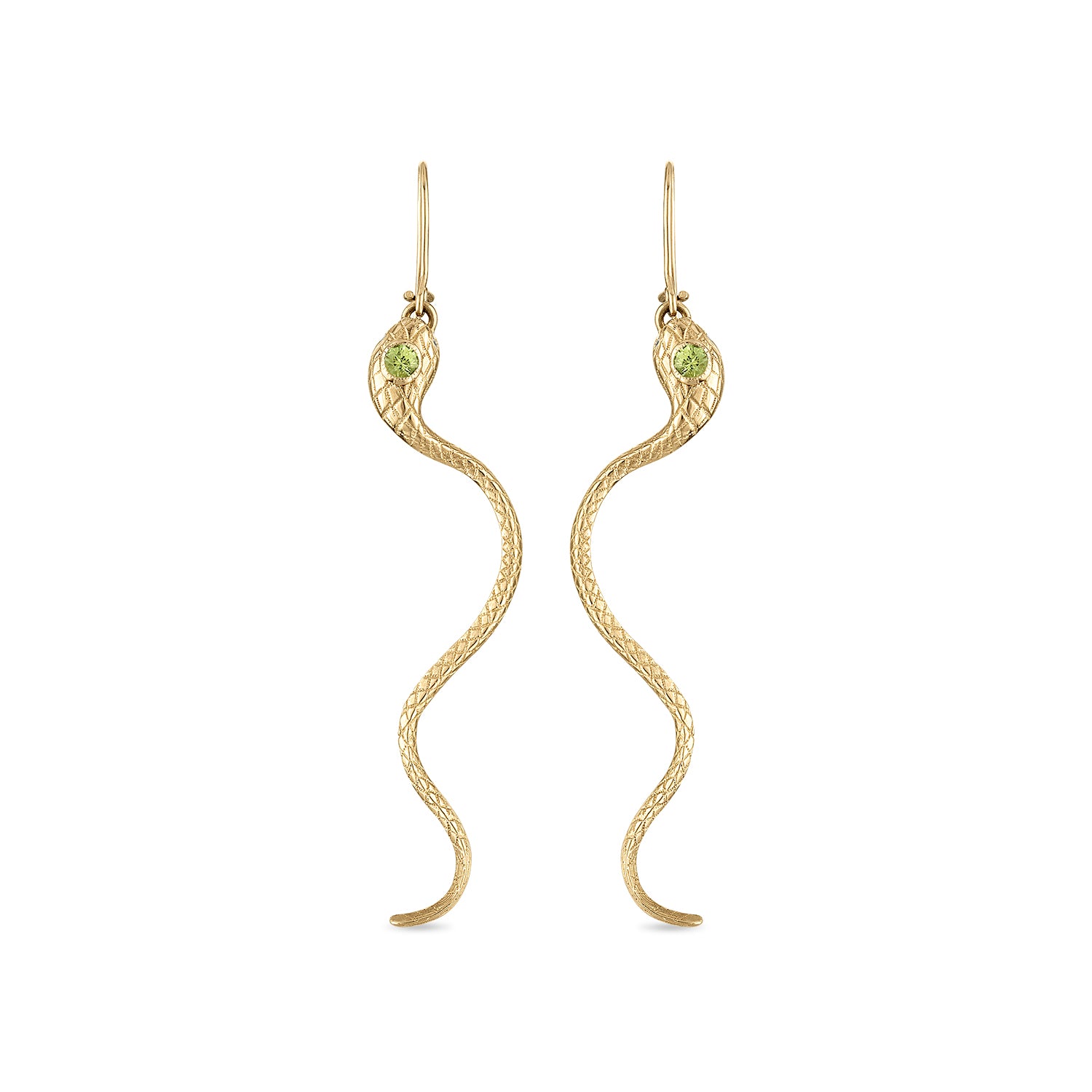 A pair of 14k gold snake earrings with engraved scales, milgrain bezel set yellow green sapphire head stones and diamond eye stones. The closed shepherd hook earrings each have a snake suspended by a ring in its mouth and long tail curving down.