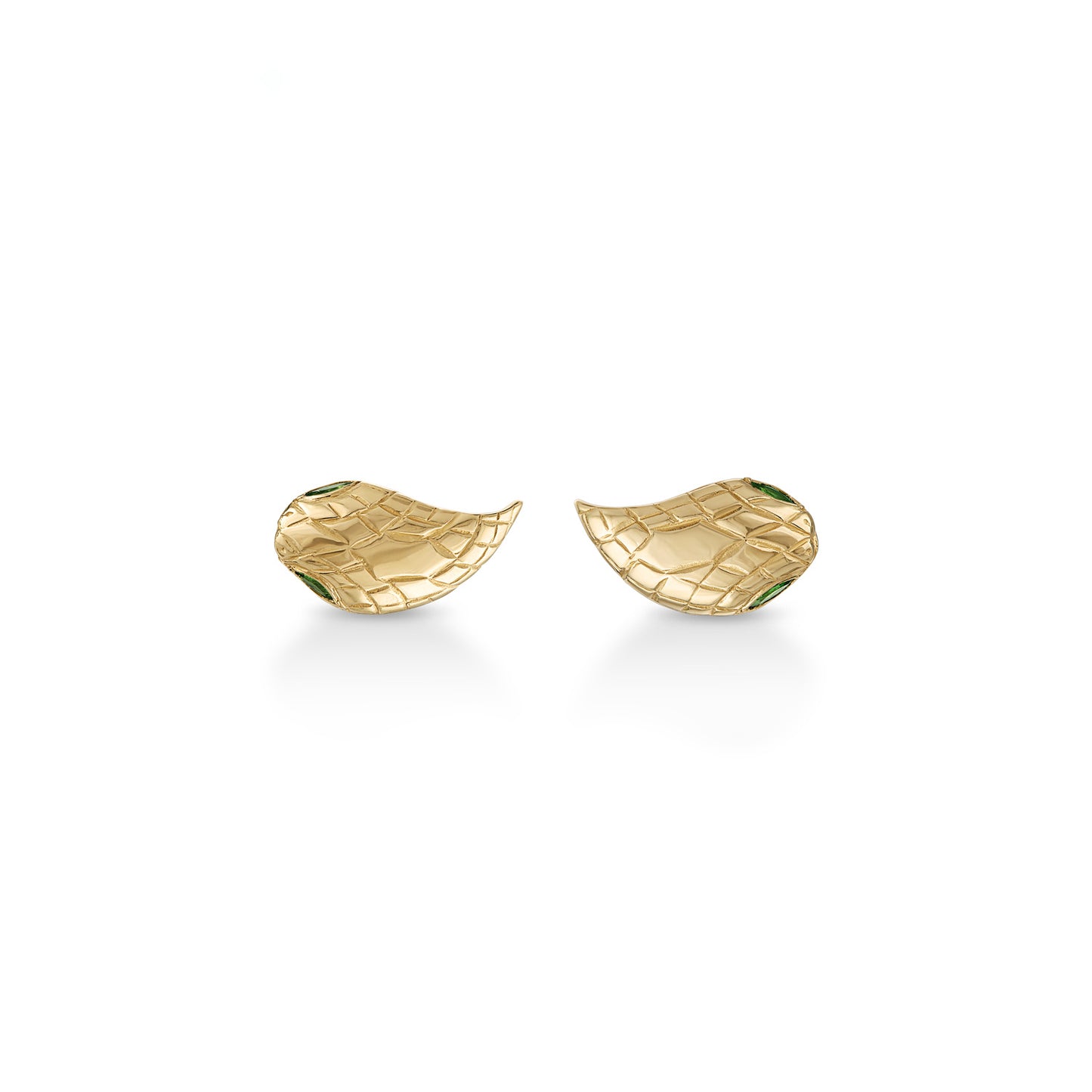 A pair of teardrop-shaped 14k gold snake head stud earrings with engraved scales and inset green marquise cut eye stones with milgrain detail.