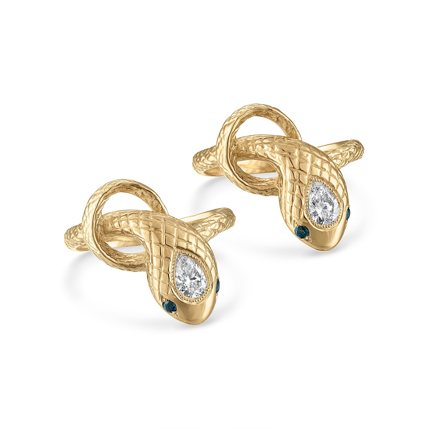 Two 14k gold snake rings with engraved scales, milgrain bezel set pear shaped diamond center stones and teal sapphire eye stones.