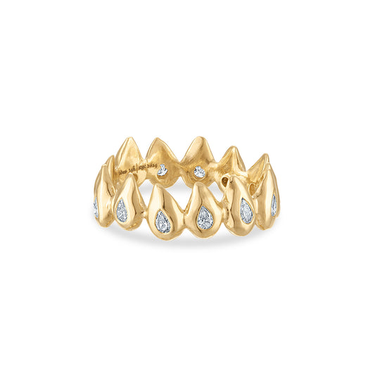 14k yellow gold ring of pointy top seeds with one burnish set pear shaped white diamond in each seed.