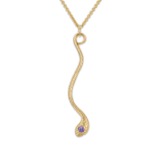 14k yellow gold vertical snake pendant suspended by its tail on a 16" 1.9mm cable chain. Snake has milgrain bezel set purple sapphire head stone and diamond eye stones.
